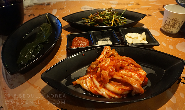 Banchan or Side dishes - kimchi, salt and pepper, garlic, lemon grass